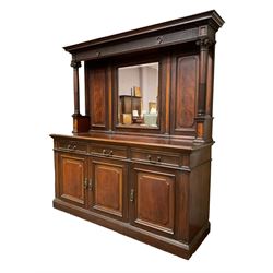 Late Victorian mahogany mirror back sideboard, projecting cornice with egg and dart carving over an arcade carved frieze, supports by fluted columns with composite capitals, rectangular bevelled plate within gadrooned frame flanked by fielded panels with foliate slips, fitted with three drawers over three cupboards, the right containing cellarette drawer