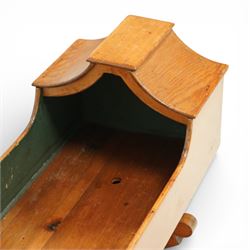 Victorian pine crib, of elongated rectangular form with raised hooded head end, painted interior, panelled sides and raised on a rocker base