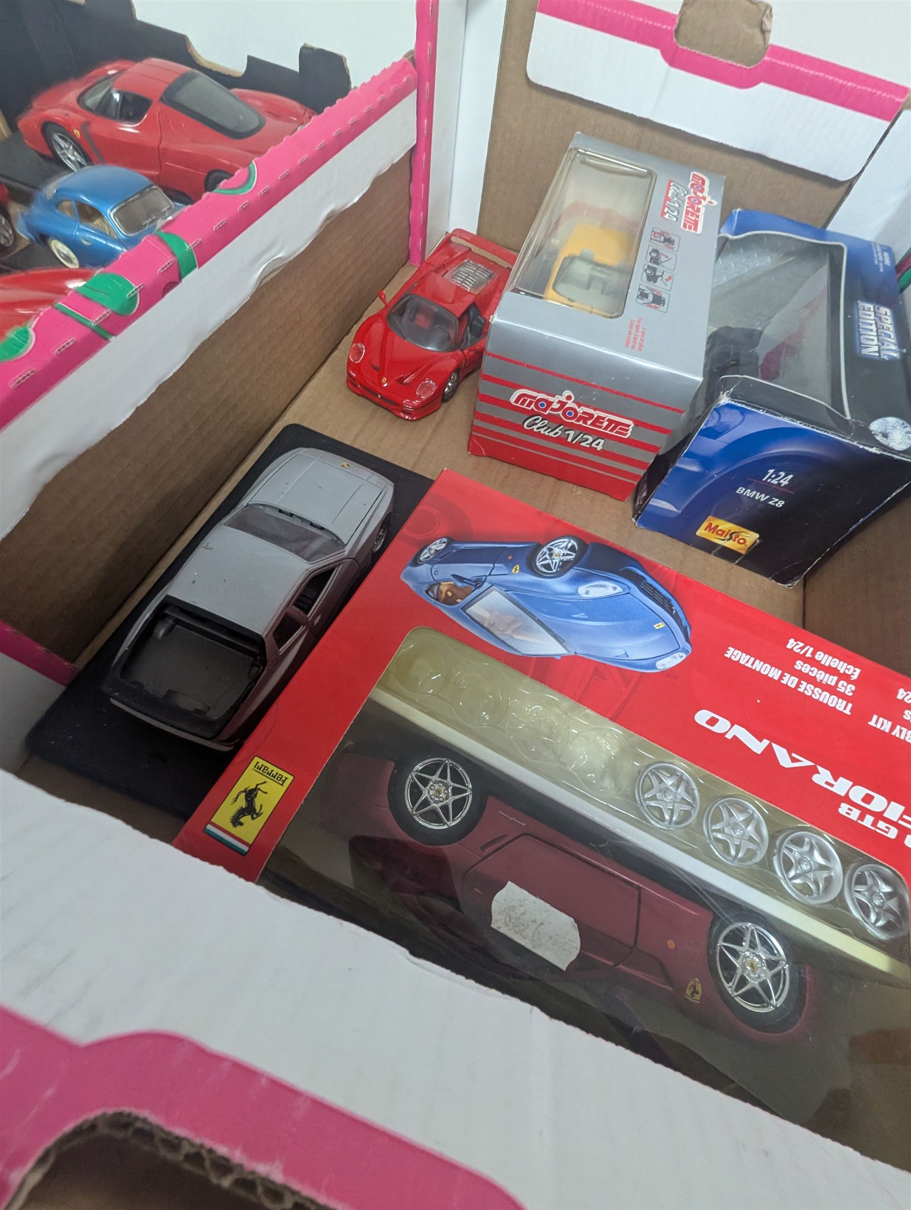 Diecast model vehicles, including Maisto, Majorette and Bburago examples, three boxed the rest loose, different scales, in three boxes