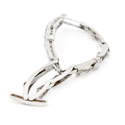 Art Deco white gold and platinum diamond bracelet, the central articulated panel milgrain set with old and single cut diamonds, to a white gold expanding link bracelet, stamped 18ct