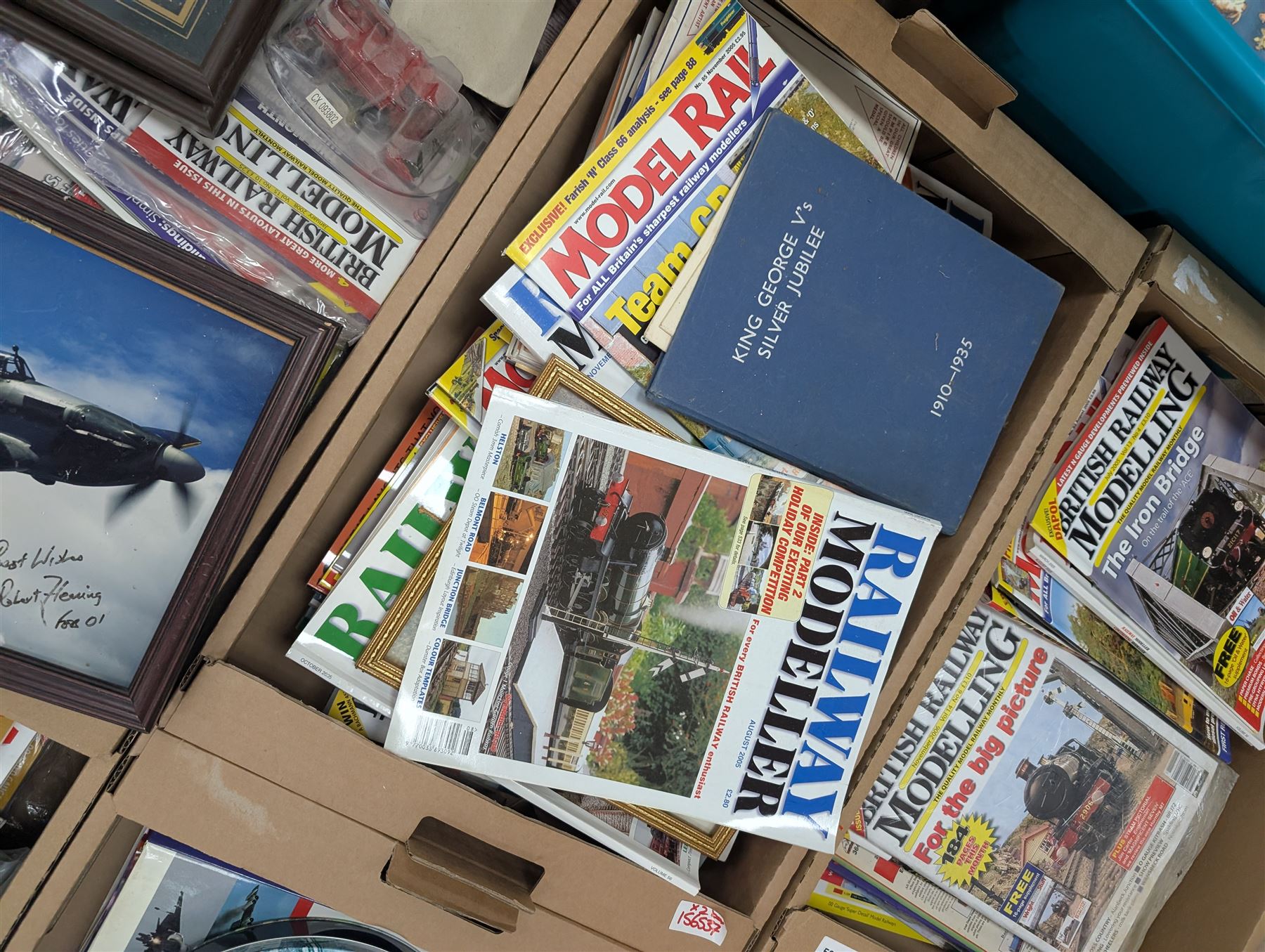 Large collection of model railway magazines, including Railyway Modeller, British Railway Modelling and Model Rail, together with railway and similar reference books, childrens books and VHS tapes in eleven boxes