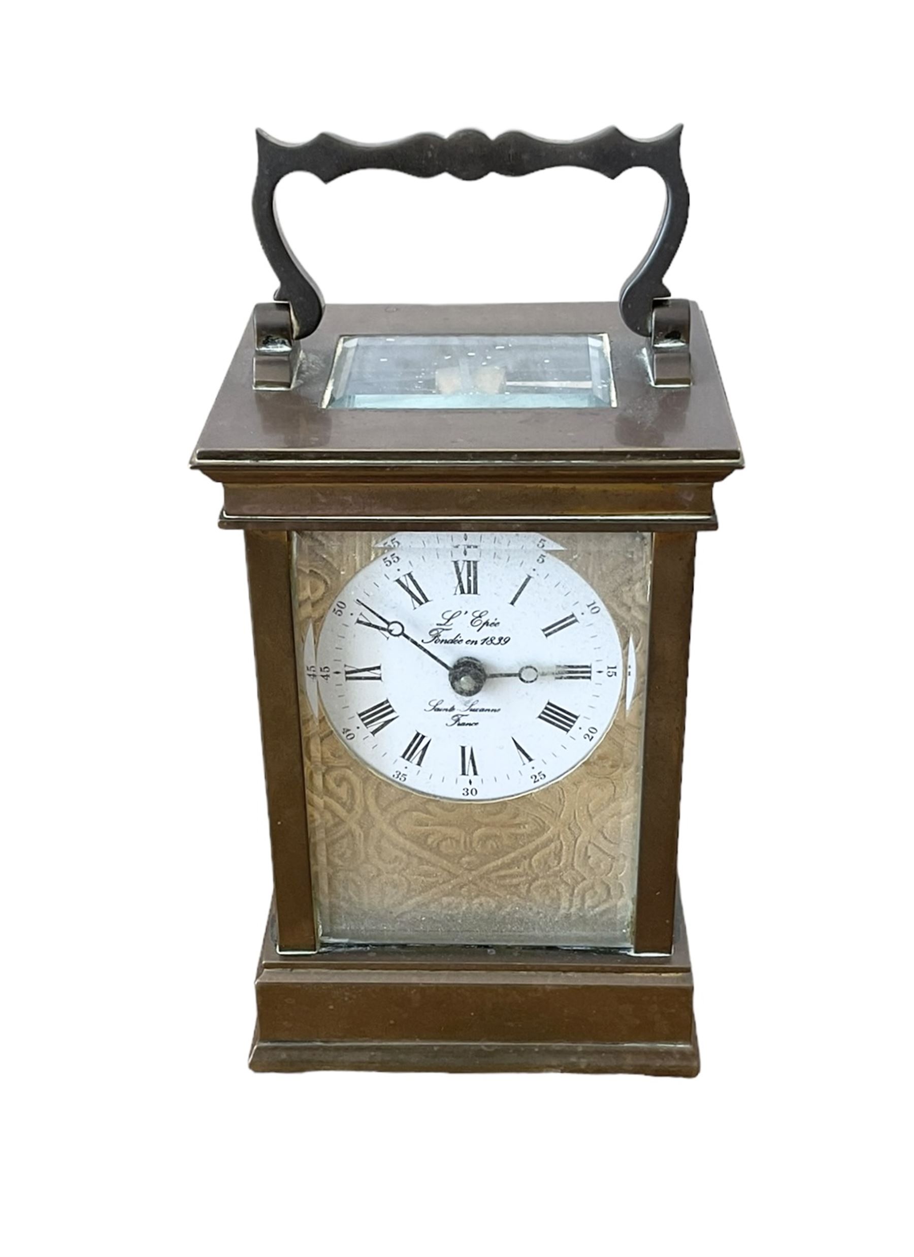 French -  brass cased 20th century  8-day timepiece carriage clock, dial inscribed L' Epee Fondee-En 1839, Sainte Suxanne, France, with a circular enamel dial and an embossed brass dial mask, Roman numerals, minute markers, five minute Arabic's and steel moon hands, with a jewelled lever platform escapement.