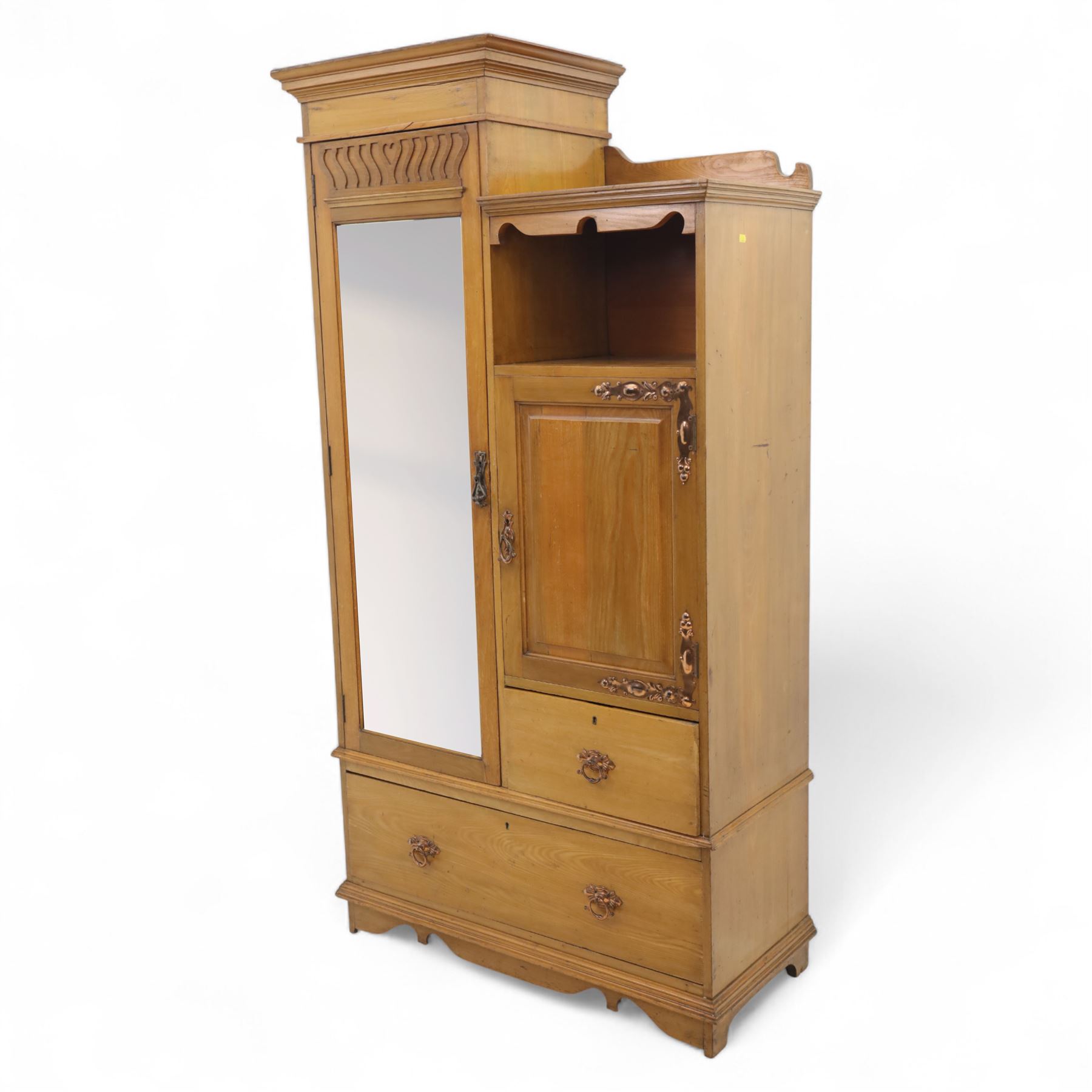 Edwardian ash combination wardrobe, moulded cornice over an open compartment and single cupboard door with carved scroll decoration, above two short and one long drawer fitted with brass handles, on shaped bracket supports
