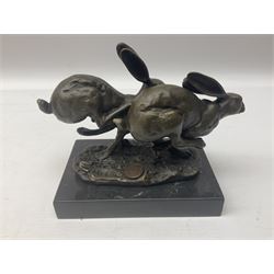 Bronze figure group, modelled as two hares in chase, after 'Nick', with foundry mark, upon a rectangular base, H11cm L15cm