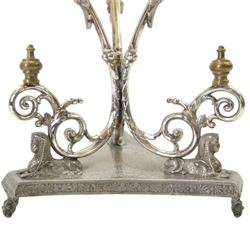 Silver plated Egyptian Revival lamp, with scrolling columns, on a trefoil base, surmounted by three sphinxes, with mask feet, H60cm