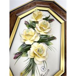 Set of three Capodimonte wall plaques, depicting floral decoration in octagonal frames with gilt edging, largest plaque H48, two small plaques H31cm.    