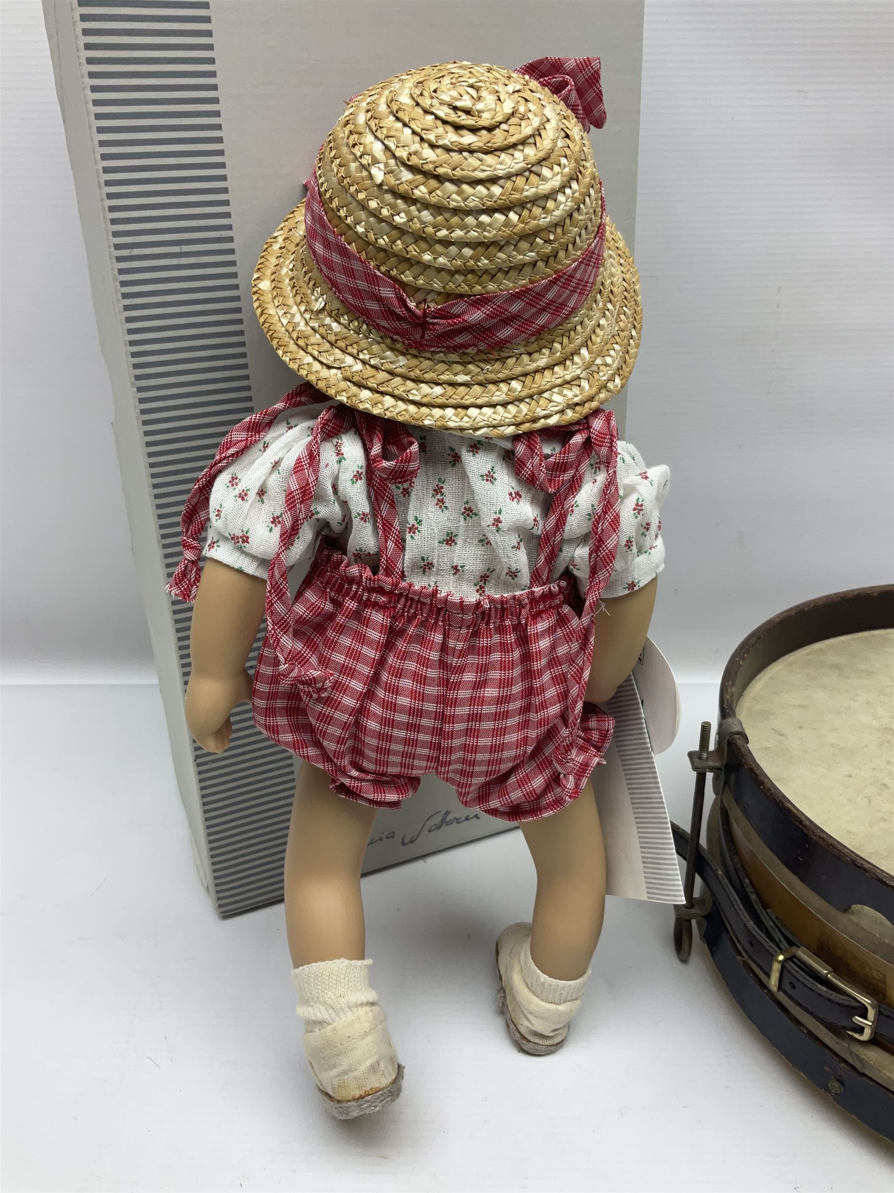 German Gotz articulated vinyl baby doll 'Claire' c1997 with original clothing, hat and labels; artist designed by Sylvia Natterer H35cm; boxed; and small child's wooden cased drum (2)