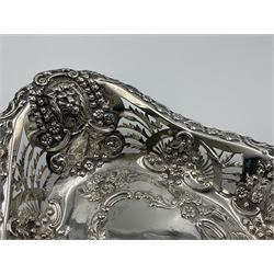 Edwardian silver swing handled basket, of navette form, with four repousse lion masks to each corner and with pierced and embossed floral, scroll and shell decoration to sides, base and handle, hallmarked Charles Horner, Birmingham 1906, height including handle H20cm