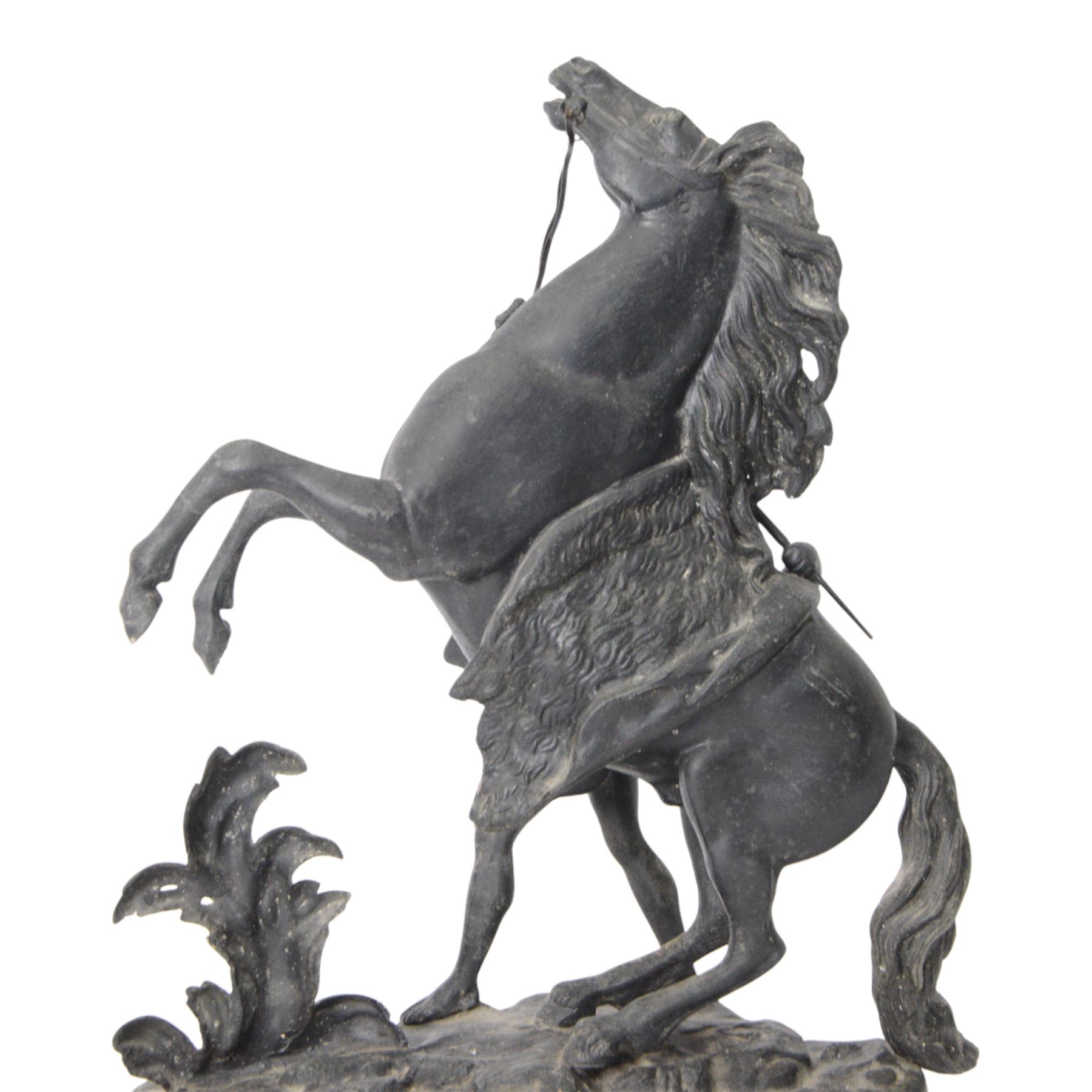Three spelter Marley Horse figures, after Guillaume Coustou, each modelled as a rearing horse restrained by  groom, tallest H41cm