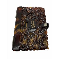 19th century tortoiseshell aide memoire, of pierced scrolling foliate design, with monogram 'HS' to the front, opening to reveal a single ivory leaf and pencil, H10.5cm W7cm