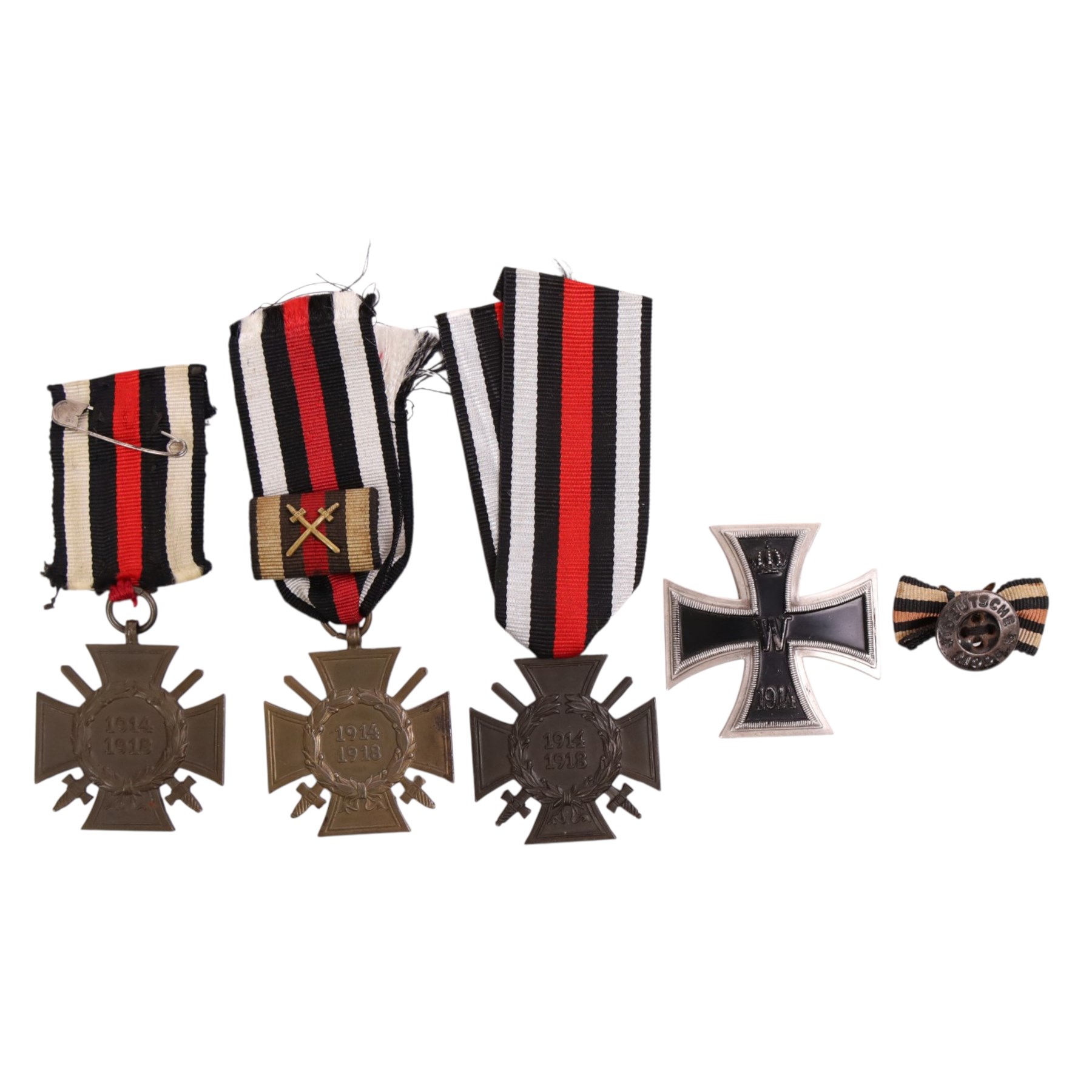 WWI three Hindenburg Cross, together with 1914 1st class iron, cross and iron cross lapel bow