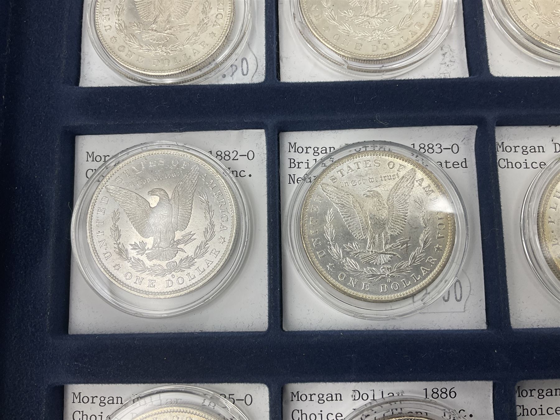 Twelve United States of America silver Morgan dollar coins, dated 1878 S, 1879 S, 1880 S, 1881 S, 1882 O, 1883 O, 1884 O, 1884 CC, 1885 O, 1886, 1887 and 1888
