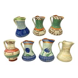 Seven Myott Son & Co hand painted jugs, all with printed mark beneath, H21cm