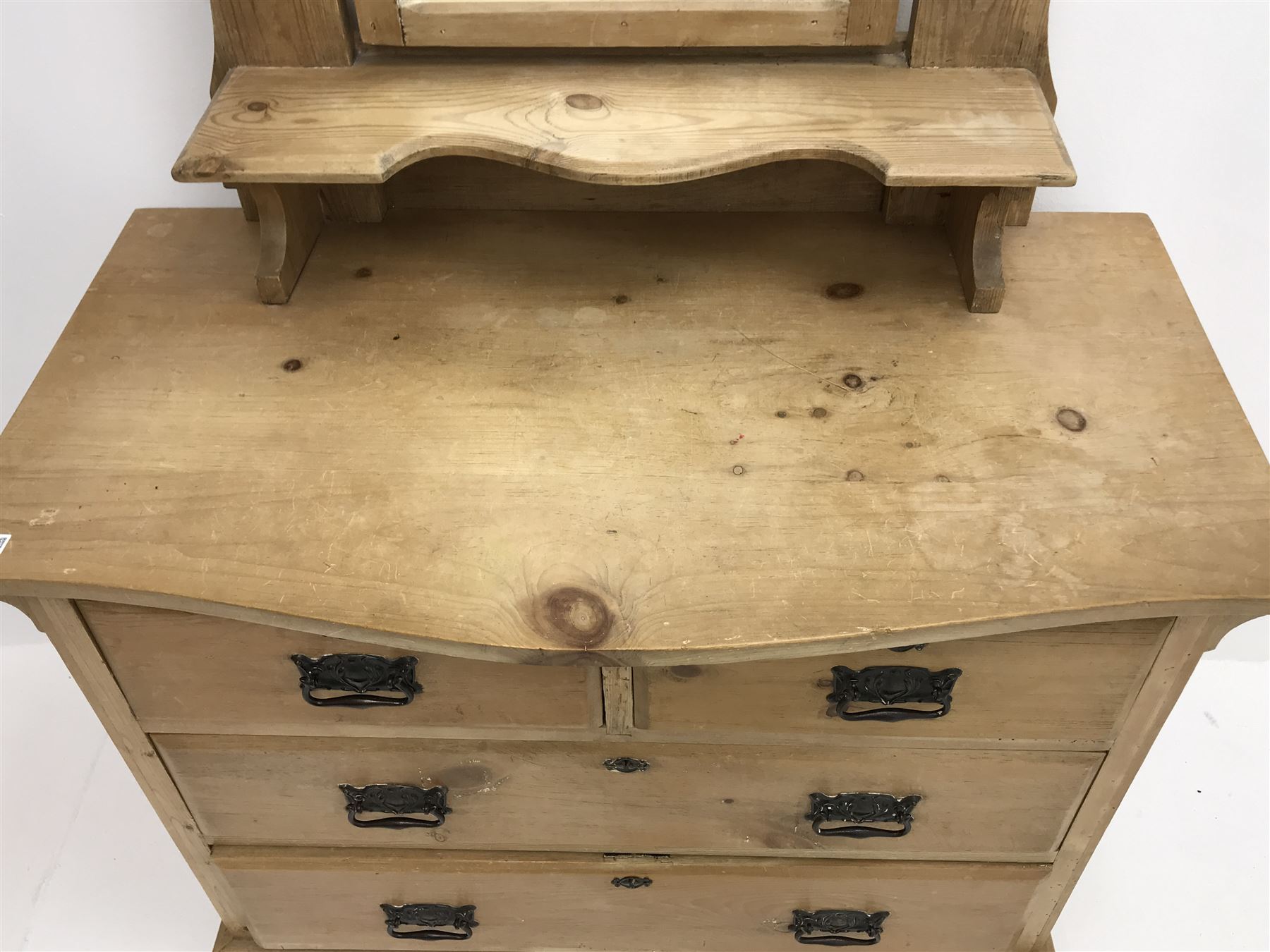 Victorian pine dressing table, raised shaped mirror back, single shelf, two short and two long drawers, shaped plinth base