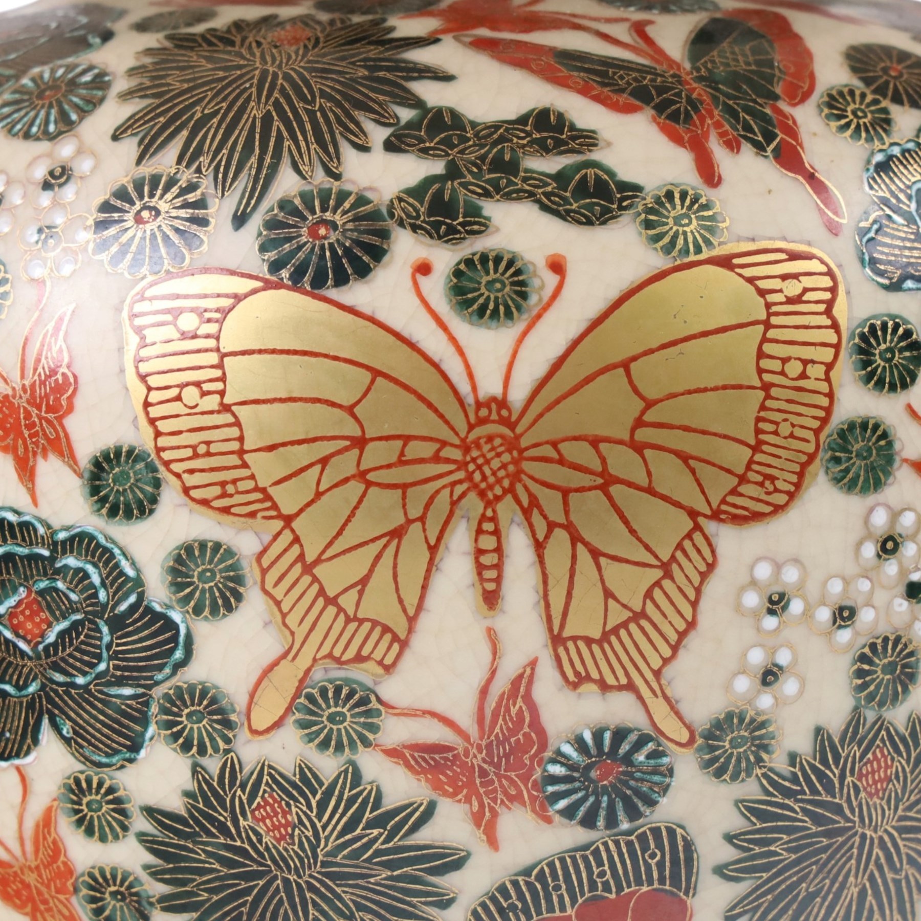 Japanese ceramics table lamp, decorated with flowers and butterflies upon a circular wooden base, H52cm