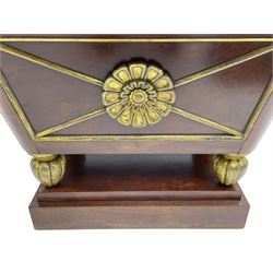 Attributed to Gillows - Regency mahogany wine cooler, the rolled moulded edge with cavetto underside, the four panelled sides decorated with applied moulded gilt rosettes and giltwood slips, with gilt lining, raised on lobe carved feet with gilt finish, upon a stepped plinth base