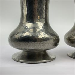 Pair of Liberty & Co Tudric pewter vases, each of bellied form with hammered finish, upon a circular spreading foot, impressed beneath 0987, H12cm