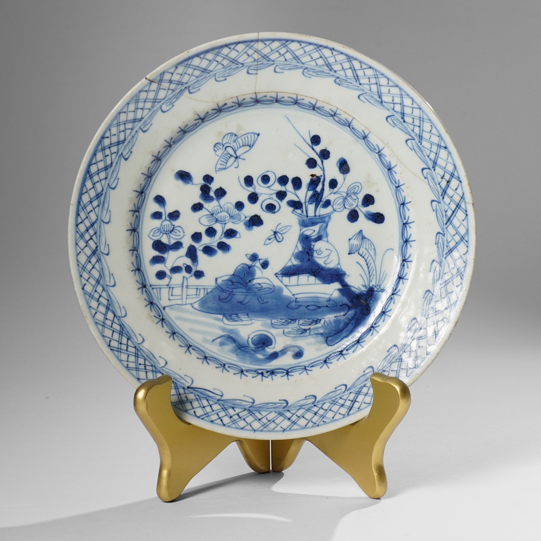 Three Chinese Kangxi period blue and white plates, painted in underglaze blue with various patterns, including Butterfly and Rockery, Pagoda and River Landscape, and floral sprays, each approx. D23cm (3)