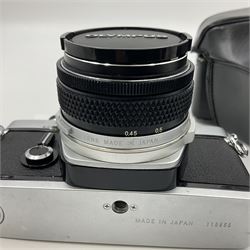 Olympus M-1 camera body, serial no. 110865, circa 1972, with ' Olympus M-System F.Zuiko Auto-S 1:1.8 f=50mm' lens, serial no. 105152, in leather case 