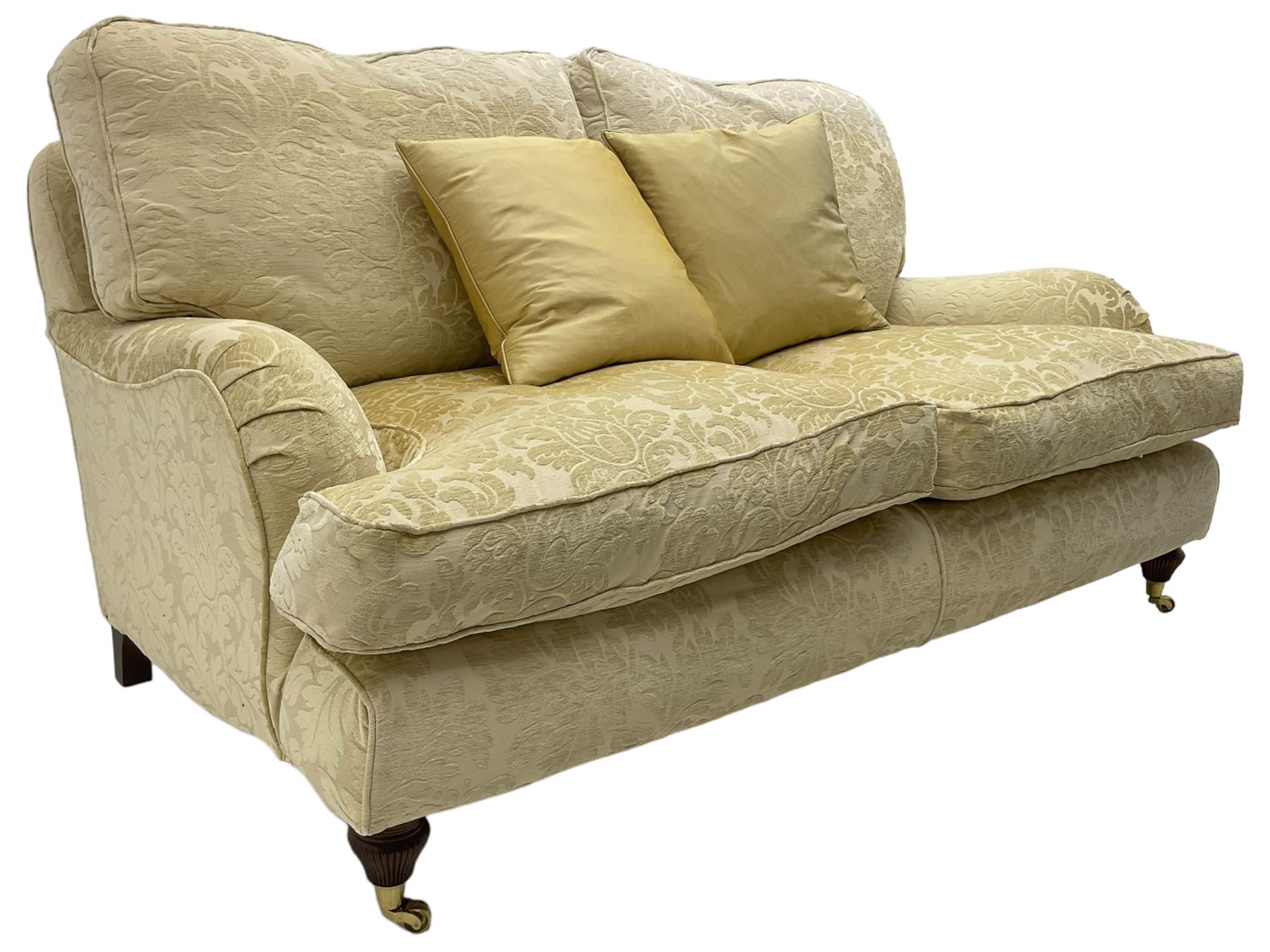 Multi-York - Howard shape two-seat sofa, upholstered in scrolling floral pattern loose covers, rolled arms, on turned front feet with brass cups and castors