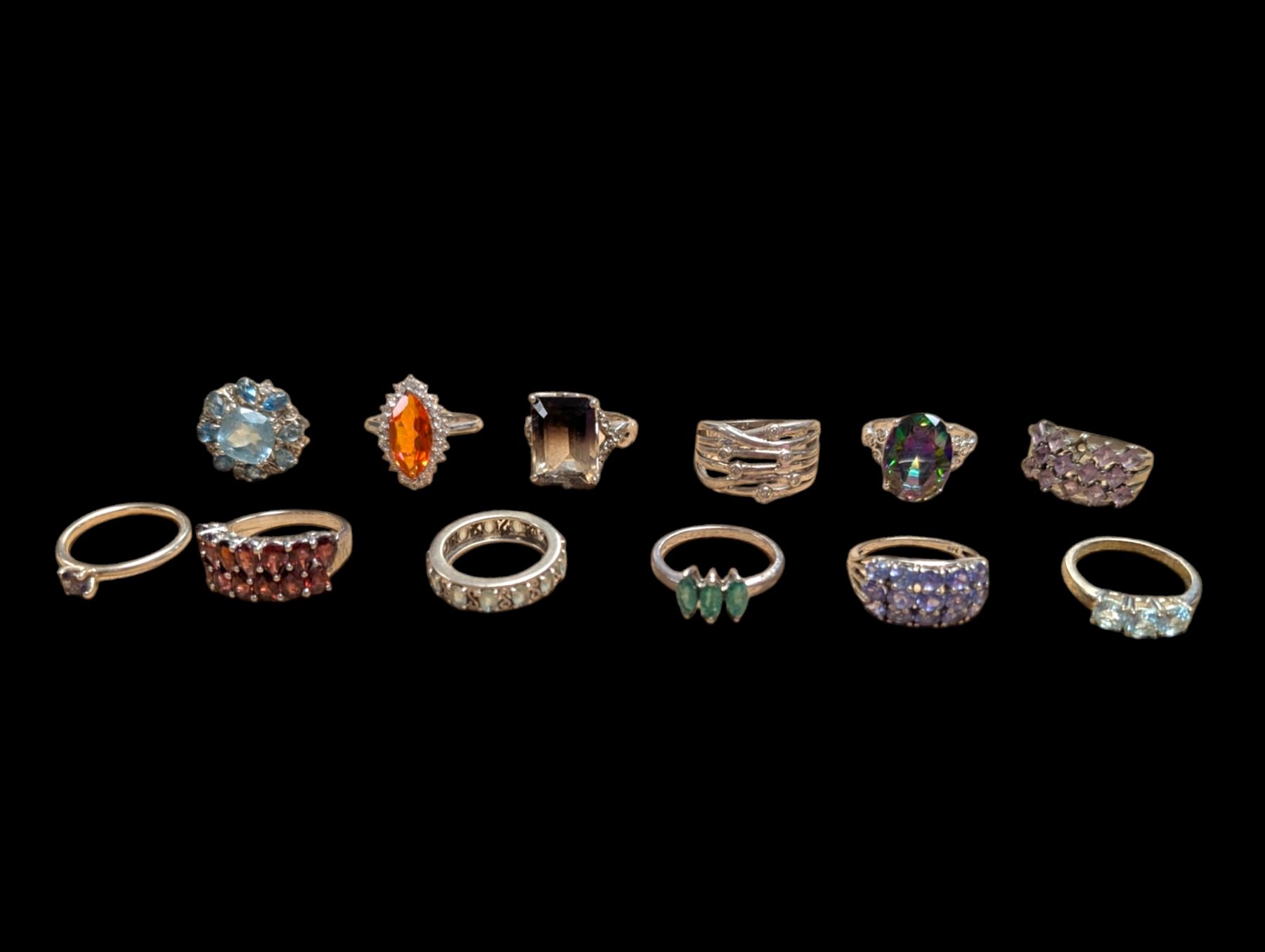Twelve silver stone set rings
