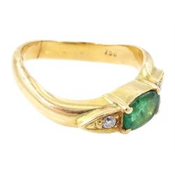 14ct gold emerald and diamond three stone ring, oval cut emerald with a round brilliant cut diamond set either side, to a wave design shank