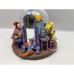 Five Disney Winnie The Pooh snow globes, to include Pooh and Piglet Sailing, Pooh's Grand Adventure and Blustery Day, together with The Walt Disney Classic Waterglobe collection globe and group Tigger, Winnie and Piglet figure under dome, all with boxes (7)