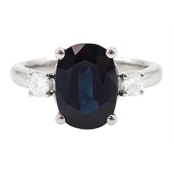 18ct white gold sapphire and diamond three stone ring, single oval cut sapphire of approx 3.00 carat, with a round brilliant cut diamond set either side, hallmarked, total diamond weight approx 0.25 carat