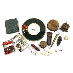 Various fishing flies, two wooden and brass mounted fishing reels, two pocket knives, a circular framed fishing fly and other tackle and accessories in one box