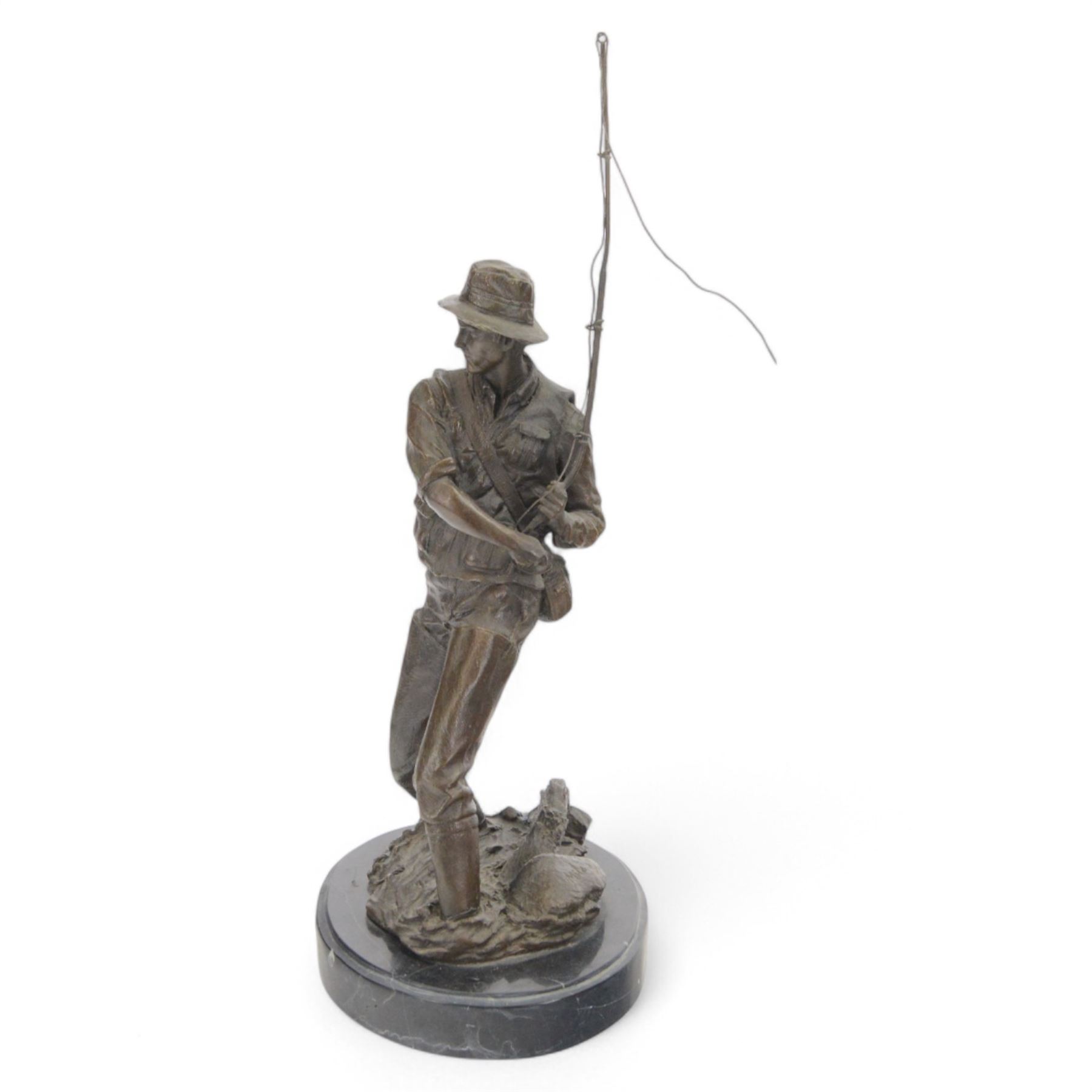 Bronzed figure of a fly fisherman, signed Milo, upon an oval marble base, H42.5cm