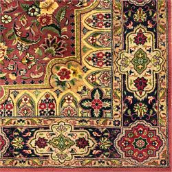Kashan design hand knotted wool carpet, decorated with an ivory and green floral medallion on a pink ground with scrolling vines, ivory spandrels, multiple navy and ivory borders with stylised flowerheads, from the region of Punjab, Pakistan
