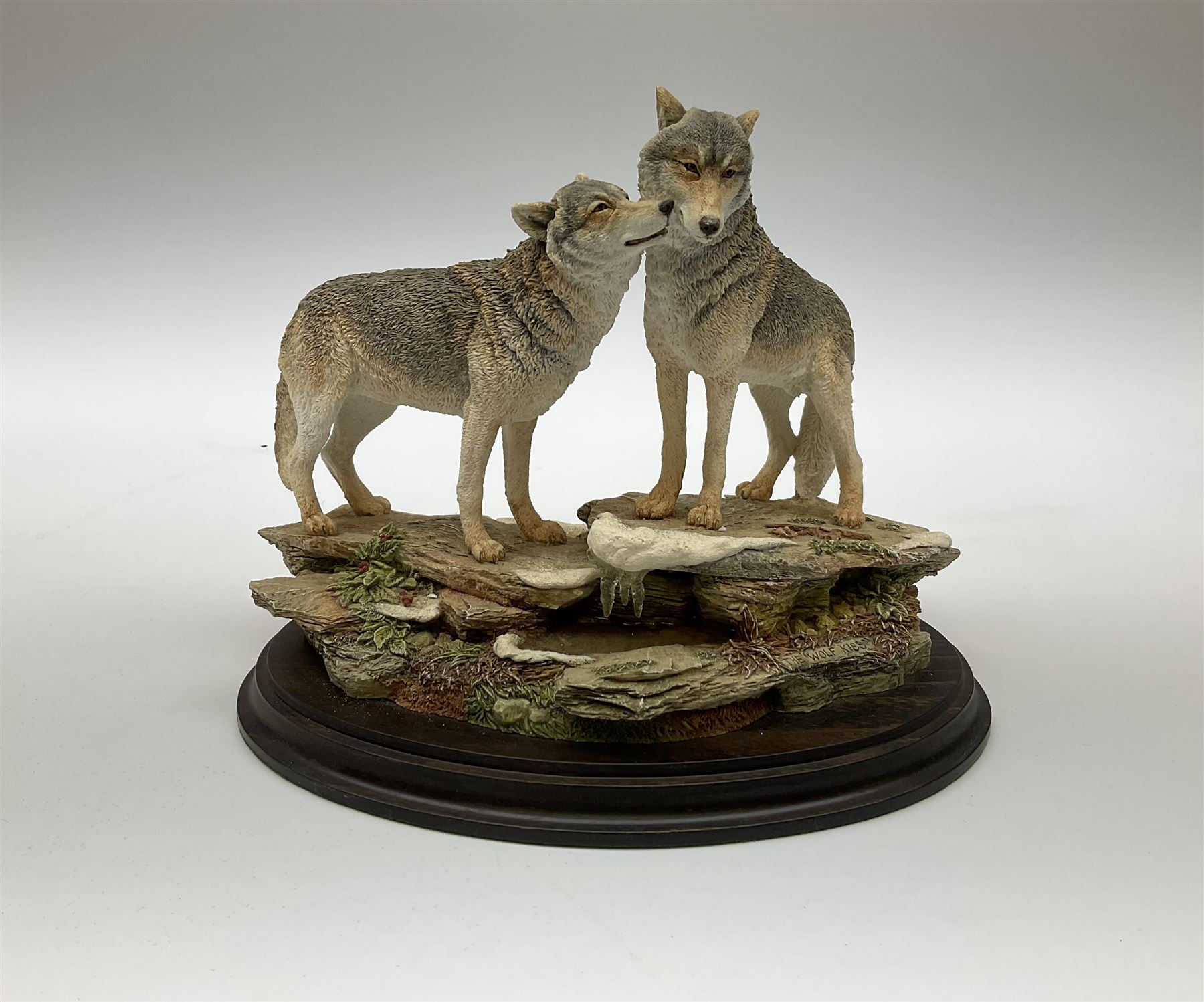 Three Franklin Mint figures, first example On The Prowl, on wooden stand H32cm, L63.5cm, Grizzly, H23cm and American Majesty by Ronald Van Ruyckevelt H37cm, together with five other figures.  