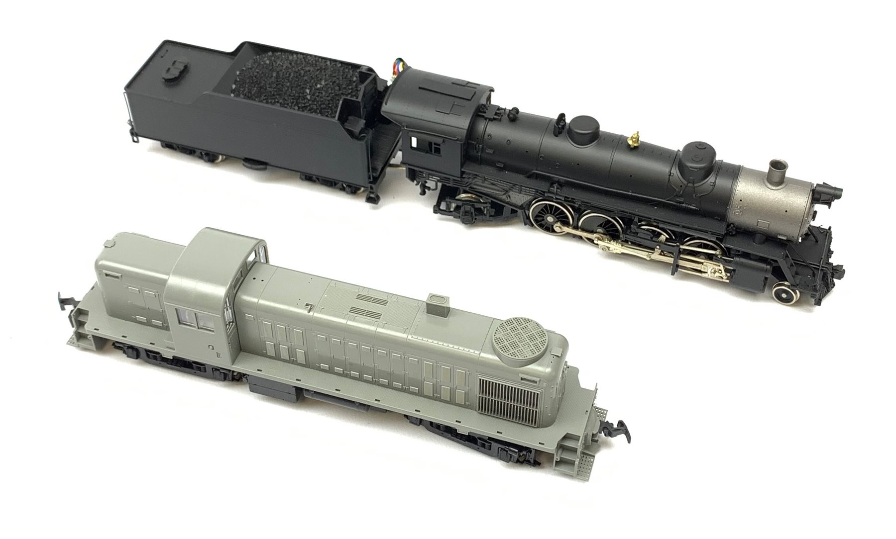 HO scale - Athearn Genesis G9010 USRA 2-8-2 locomotive; and Kato Alco RS2 37-2100 locomotive with unopened sprue parts for completion, both undecorated mint and boxed with paperwork (2)