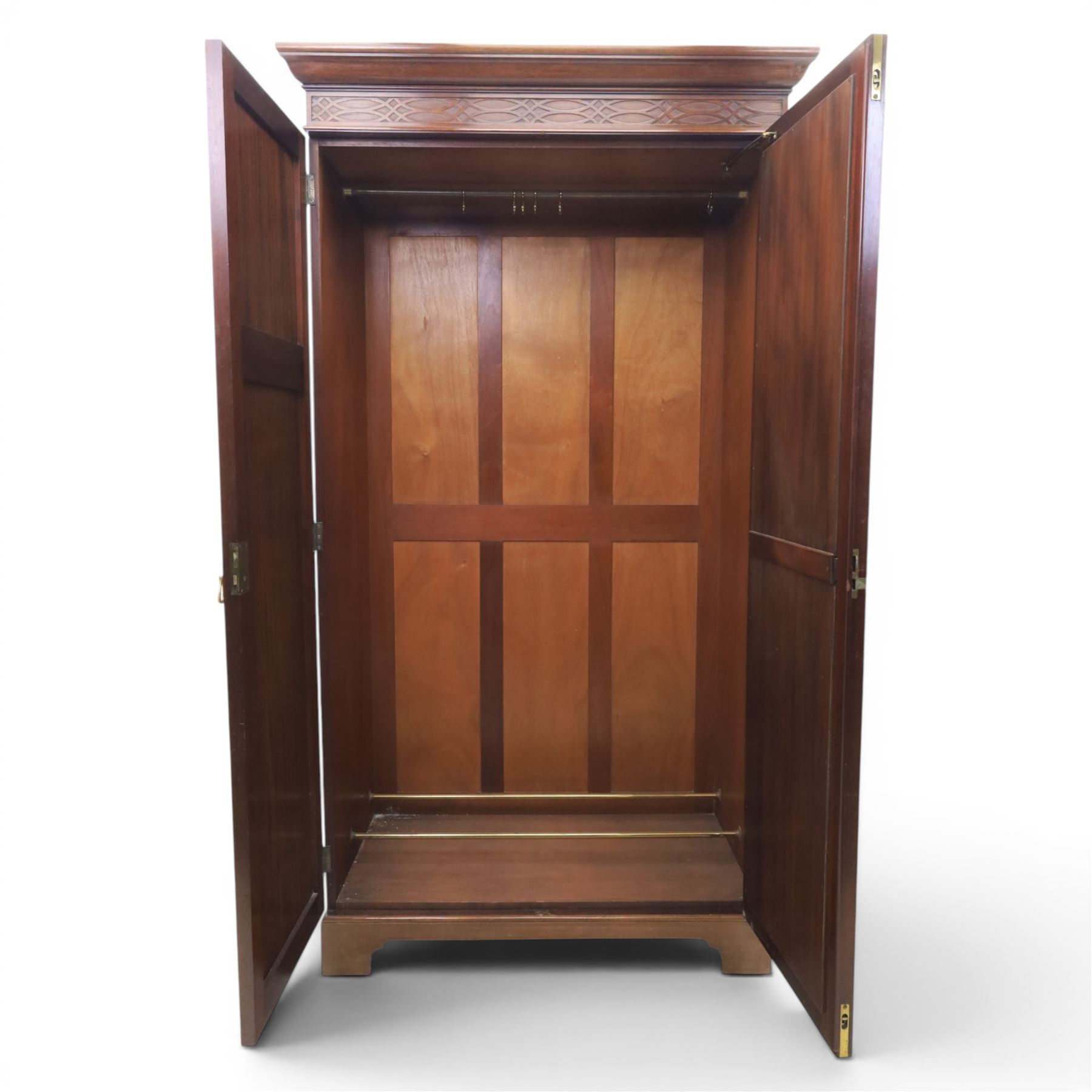 Quality Edwardian mahogany double wardrobe, featuring bevelled mirrored and panelled door with applied moulded detail, internal brass rail hanging and shoe rails