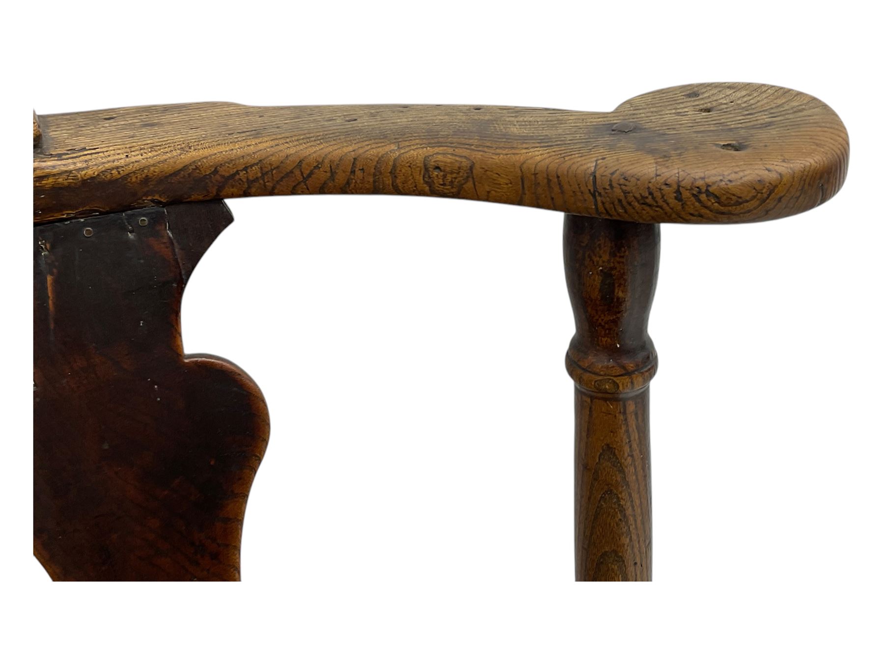 18th century oak corner elbow chair, the shaped cresting rail terminating to swept arm rests, supported by turned columns and vase-shaped splats, over square plank seat, raised on square-section supports