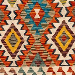 Afghan kilim ivory ground runner rug, the field with three columns of repeating lozenge motifs with amber and multicoloured tones, enclosed by a guard band decorated with repeating stylised hooks