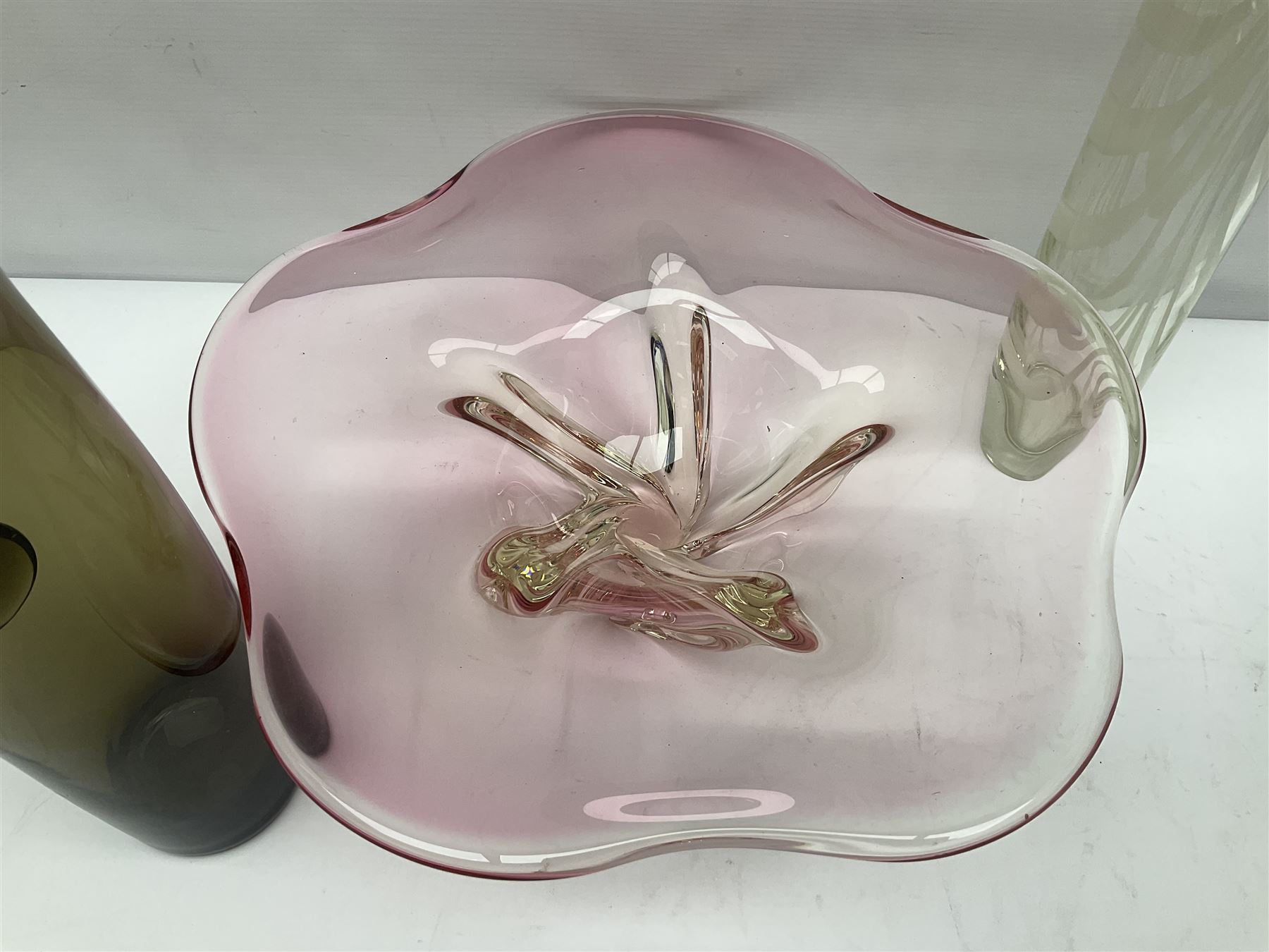 Two Whitefriars glass jugs, together with a Swedish Pukeberg art glass vase and three art glass bowls, including large pink example, some signed to base, tallest H30.5cm