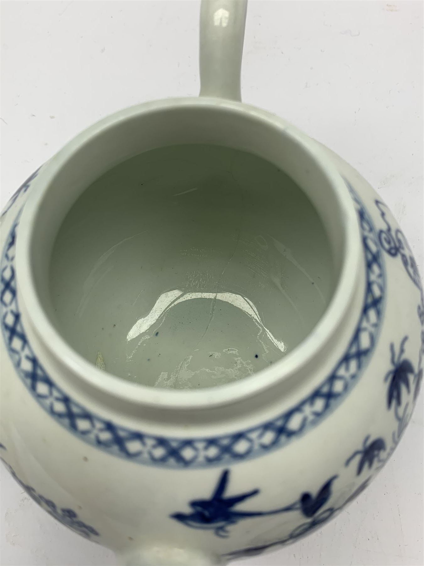 18th Century Worcester teapot, circa 1765-70, decorated in the Bird in the ring pattern, the cover with bud finial, with crescent mark beneath, H13cm, together with a Worcester coffee cup decorated in the same pattern, with crescent mark beneath, H6.5cm