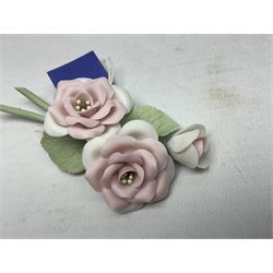 Seven Lladro flowers, comprising Japanese Camelia on base no 5181, Yellow Begonia on base no 5186, Miniature Begonia on base no 5188, Chrysanthemum on base no 5189, California Poppy no 5190.B, Miniature Begonia 5188.B and White Carnation no 5184.B, together with Lladro Spanish Joining pack with 17616 Winter Bell, Additional Lladro parasols and flowers etc 