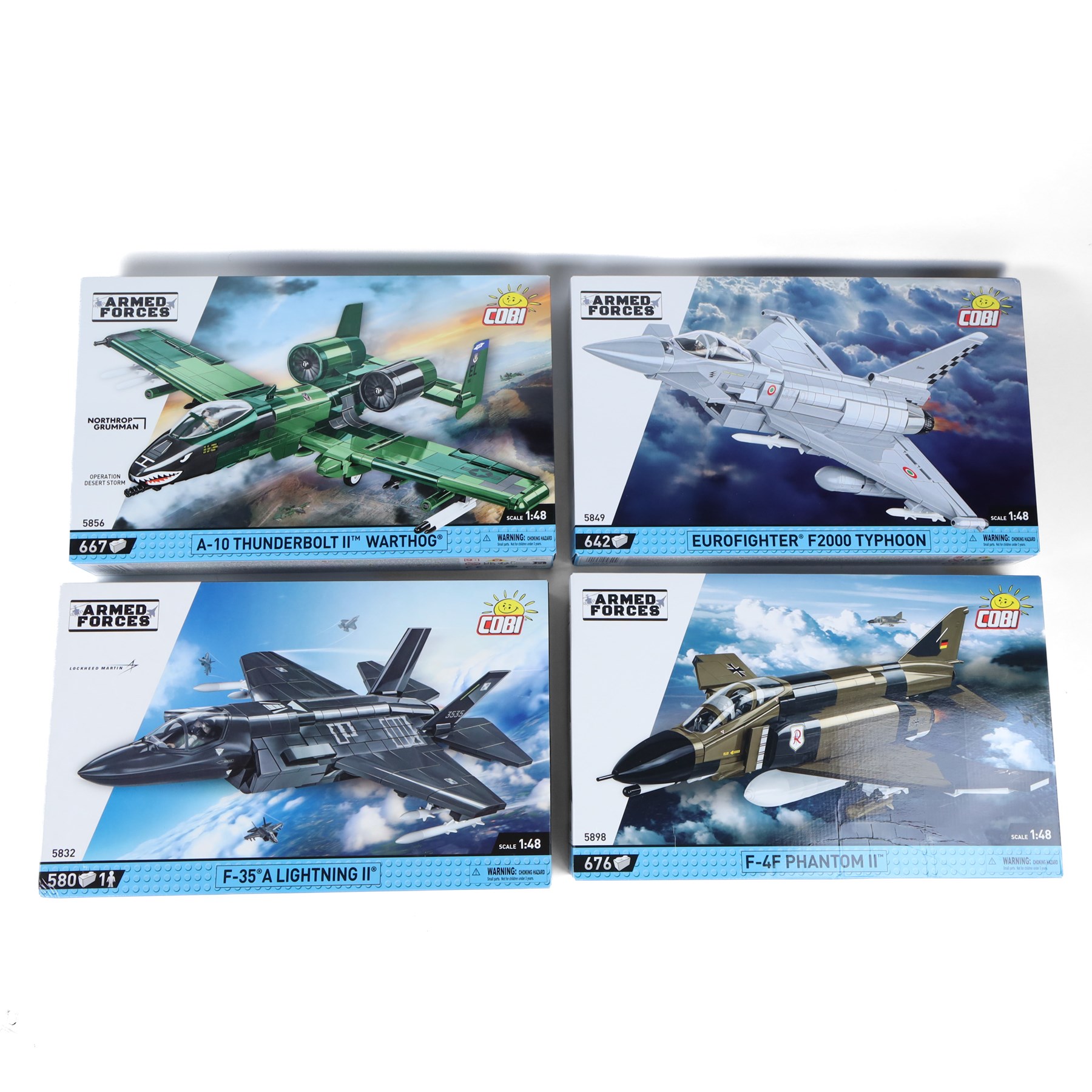 Four Cobi Bricks 1:48 scale Armed Forces sets, comprising no. 5856 A-10 Thunderbolt II Warthog, no. 5849 Eurofighter F2000 Typhoon, no. 5898 F-4F Phantom II and no.5832 F-35 A Lightning II, all in sealed boxes
