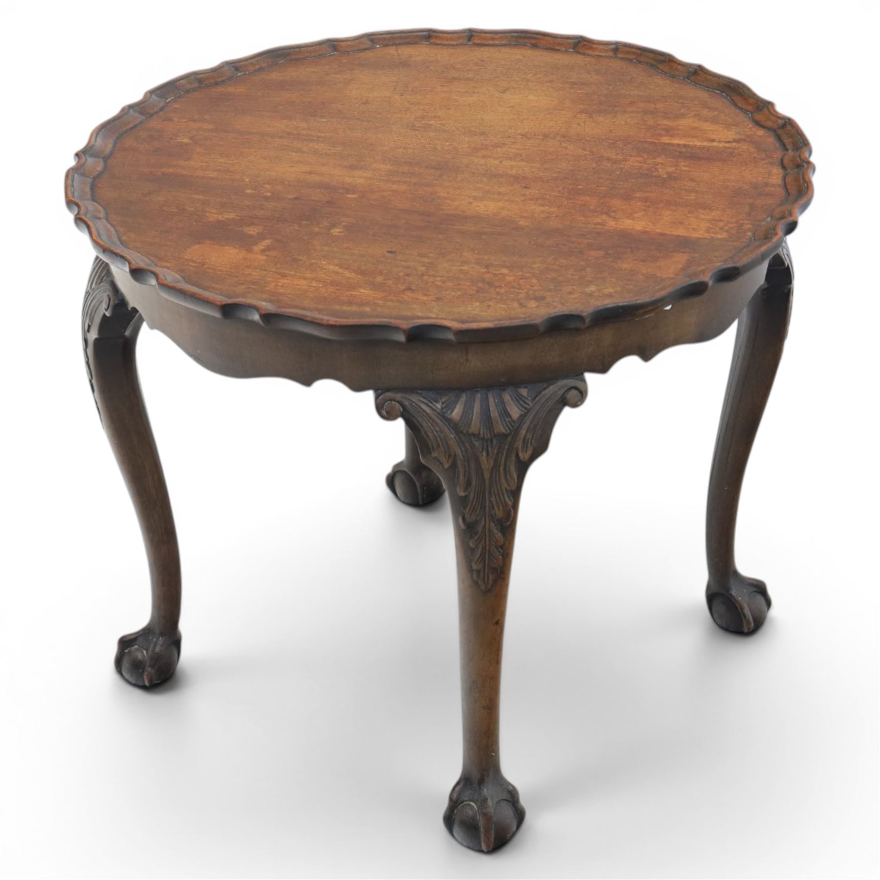 Georgian design piecrust coffee table with acanthus carved cabriole supports, seated on ball and claw feet
