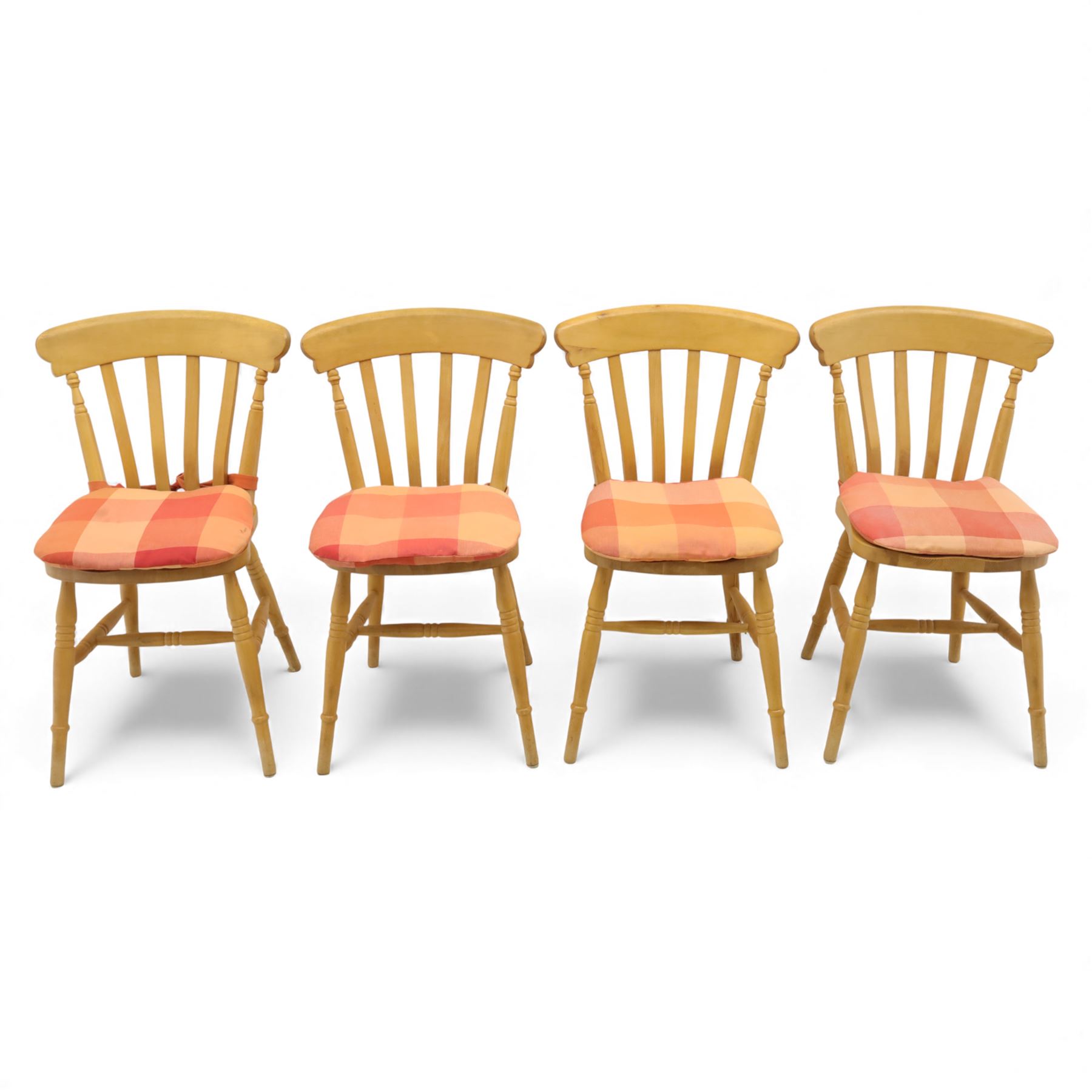 Late 20th century pine farmhouse dining table, rectangular top raised on turned legs, together with a set of matching spindle-back chairs with padded seats
