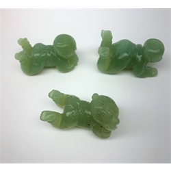 Three carved jade figures modelled as babies, approximately L5cm. (3). 