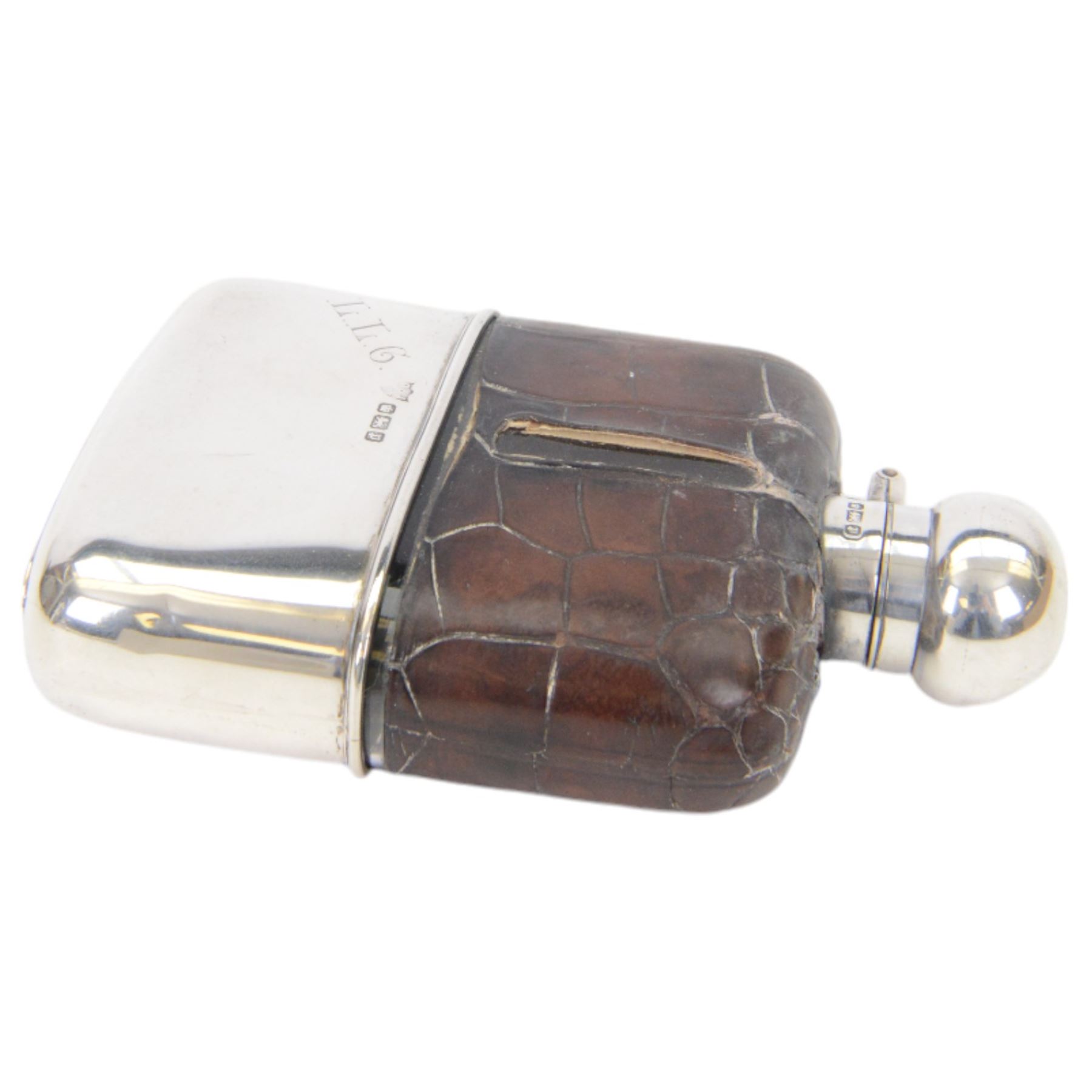Edwardian silver mounted hip flask, the glass body overlaid with crocodile effect leather, with silver collar, cap and removable cup engraved with initials, all hallmarked G & J W Hawksley, Sheffield 1907, H13cm