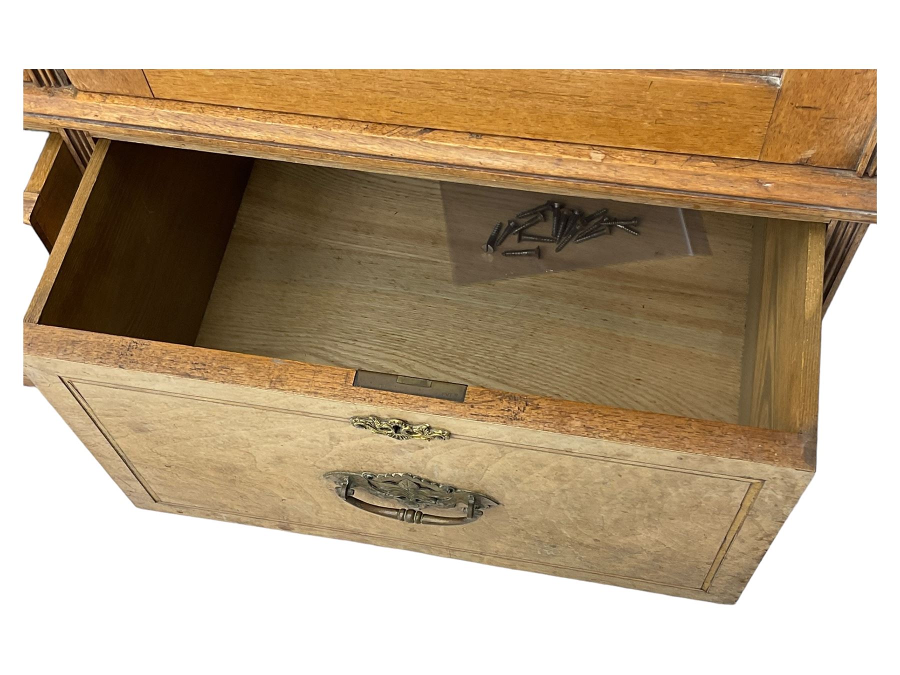 Late Victorian walnut triple combination wardrobe, projecting moulded and dentil cornice, central shaped bevelled mirror glazed door, cartouche and curled leaf carved panels over figured walnut veneered panels, fitted with drawer to base, on bracket feet