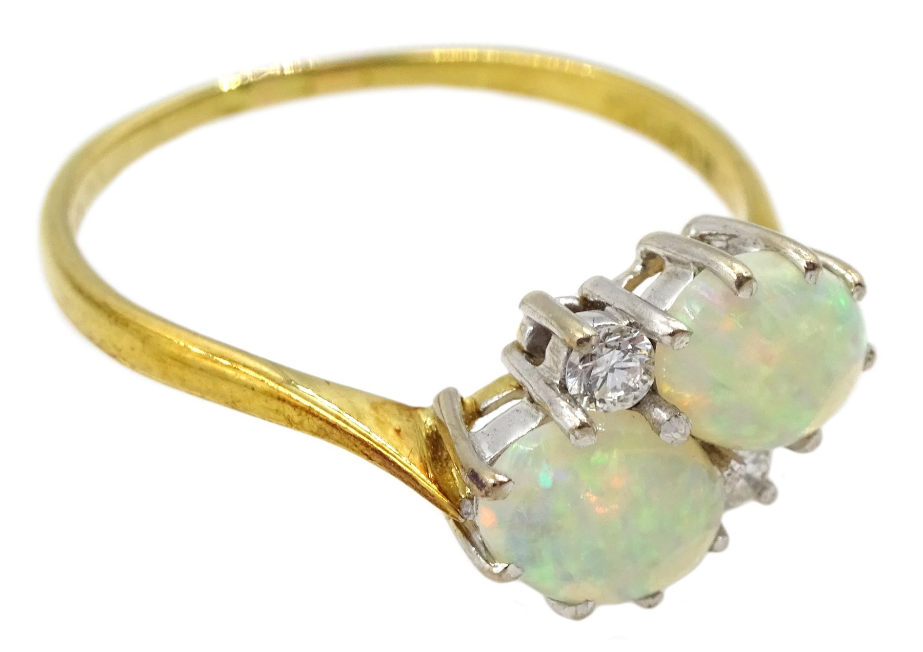 18ct gold two stone oval opal and two stone round brilliant cut diamond crossover ring, London 1981