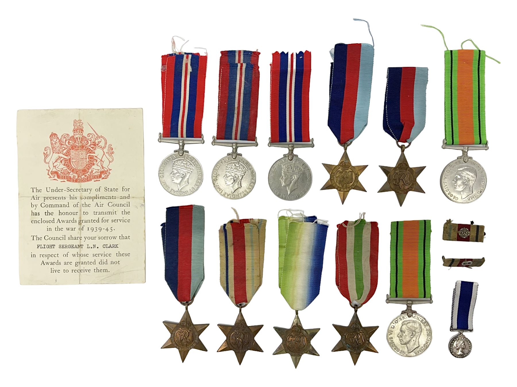 Eleven WW2 medals comprising three 1939-1945 war medals, two Defence medals, three 1939-1945 Stars, Atlantic Star, Africa Star and Italy Star; miniature QEII Naval LS & GC medal; all with ribbons; and WW2 postumous medal slip to Flight Sergeant L.N. Clark