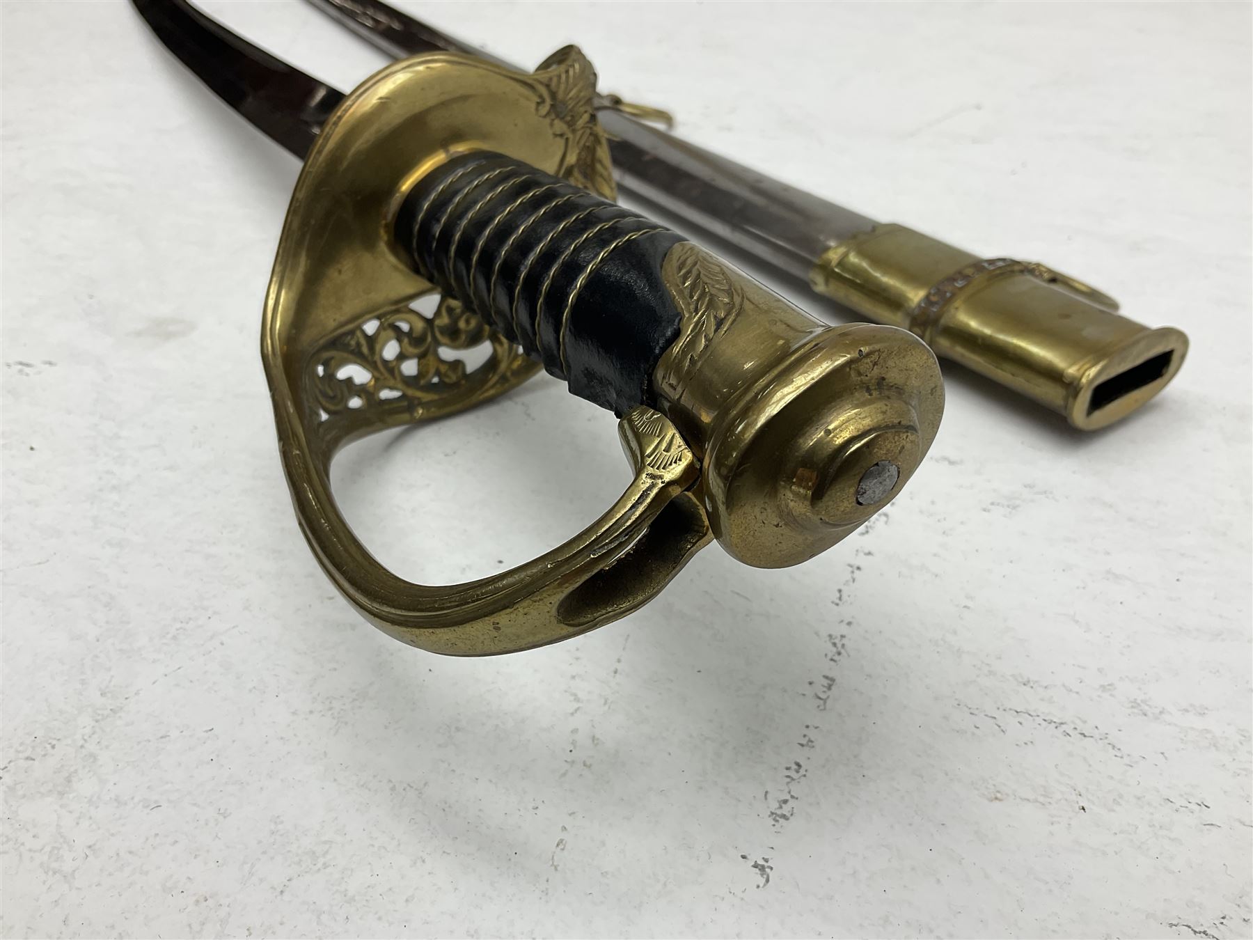 Reproduction American Civil War Cavalry trooper's sword, the 88cm slightly curving fullered steel blade marked to the ricasso 'Ames & Co Chicopee Mass.' and 'US ADK 1862'; brass hilt and leather covered grip; in steel scabbard L110cm overall;  and another reproduction sword (2)