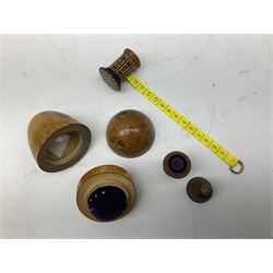 Collection of early 20th century and later thimble holders, to include a coquilla nut example, a floral decorated examples etc together with parquetry wooden tape measure 
