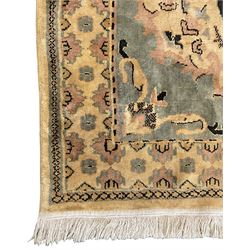 Persian design rug, pale ground with overall foliate design, the border decorated with stylised motifs 